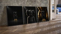 KAWS Companion Matte Black and Gold Set of 3 leaning on parquet beside a vintage loft door