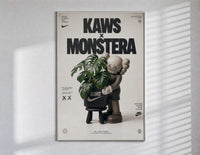 KAWS Companion figure holding monstera plant poster in a slim frame on a bright wall with soft window light