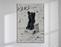 KAWS Companion figure sitting poster in a slim frame on a bright wall with soft window light