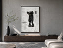 KAWS Companion Passing Through figure poster framed above a wood console in a concrete-wall living room