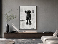 KAWS Companion Passing Through figure poster framed above a wood console in a concrete-wall living room