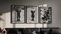 KAWS Companion figure triptych in three black frames on a grey wall above a leather sofa