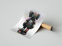 KAWS graffiti street edition standing figure with colorful tags, partially unrolled print on gray surface