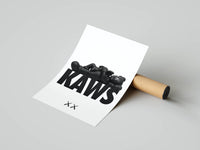 Reclining KAWS companion print with bold lettering and XX motif rolled and resting beside a cardboard tube