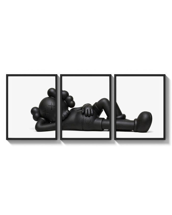 KAWS Companion Black Monochrome Set of 3 arranged on a bright gallery wall