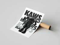 Standing KAWS figure print with fading stacked typography rolled up next to its cardboard packaging tube