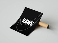 Black KAWS typography poster with a white swoosh outline partly unrolled from its shipping tube