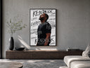 Man looking upward in profile poster framed above a wood console in a concrete-wall living room