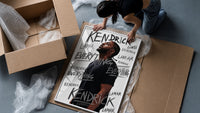 Man looking upward in profile framed print being unpacked from protective bubble wrap and a box