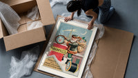 Santa Claus on snowy rooftop framed print being unpacked from protective bubble wrap and a box