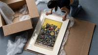 King of Pentacles tarot figure framed print being unpacked from protective bubble wrap and a box