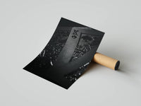 King of spades close-up dark poster partially unrolled from a cardboard tube