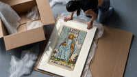 King of Swords tarot figure framed print being unpacked from protective bubble wrap and a box