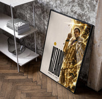 Man in gold striped suit pointing up poster in a black frame leaning beside a shelf in a raw-plaster loft