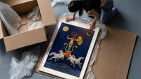 Rooster-headed Abraxas deity on chariot framed print being unpacked from protective bubble wrap and a box