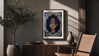 Upraised hand with alchemical symbols poster framed above a fluted sideboard beside an olive tree