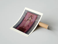 Rolled Egyptian goddess Isis unveiled poster beside its crush-resistant kraft shipping tube