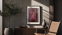 Egyptian goddess Isis unveiled poster framed above a fluted sideboard beside an olive tree