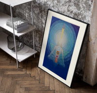 Meditating figure with chakra symbols poster in a black frame leaning beside a shelf in a raw-plaster loft