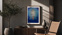 Meditating figure with chakra symbols poster framed above a fluted sideboard beside an olive tree