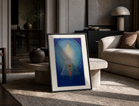 Meditating figure with chakra symbols print in a black frame leaning on a travertine table in a sunlit lounge