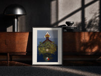 Black-framed Inverted tree with crown print on a moody console with designer coffee-table books