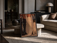 Knee-High Boots in Black and Beige print on the floor, leaning against a travertine table
