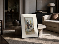 Knight riding horse holding cup print in a black frame leaning on a travertine table in a sunlit lounge