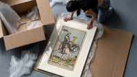 Knight riding horse holding cup framed print being unpacked from protective bubble wrap and a box