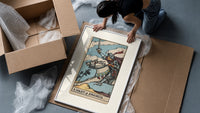 Armored knight riding horse with sword framed print being unpacked from protective bubble wrap and a box