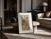 Knight riding horse holding wand print in a black frame leaning on a travertine table in a sunlit lounge