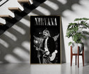 Kurt Cobain Nirvana Live framed print on a staircase entryway wall beside a plant