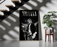 Kurt Cobain Nirvana Live framed print on a staircase entryway wall beside a plant