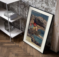 French Riviera coastal railway scene poster in a black frame leaning beside a shelf in a raw-plaster loft