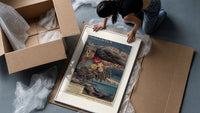 French Riviera coastal railway scene framed print being unpacked from protective bubble wrap and a box