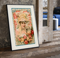 Victorian woman in bonnet with flowers print in a black frame leaning beside a vintage door on parquet