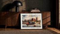 Lambeth Palace on the Thames print in a black frame leaning against a walnut console in lamplight