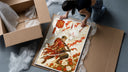 Soccer player samurai with katana framed print being unpacked from protective bubble wrap and a box