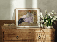 Two reclining women on sofa print in an oak frame on a farmhouse dresser beside white tulips