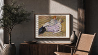 Two reclining women on sofa print in a wood frame above a fluted sideboard beside an olive tree