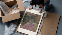 Woman in pink dress portrait framed print being unpacked from protective bubble wrap and a box