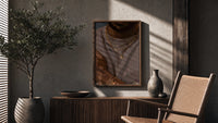 Layered Gold Chains on Taupe poster framed above a fluted sideboard beside a potted tree