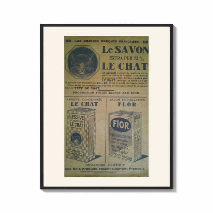 Framed Vintage French soap advertisement with cat print shown as a bold statement piece on a clean gallery wall