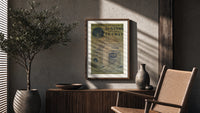 Vintage French soap advertisement with cat poster framed above a fluted sideboard beside an olive tree