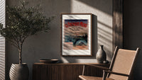 Coastal seaside town harbour view poster framed above a fluted sideboard beside an olive tree