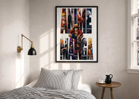 Anime hero collage print in a black frame above a bed with striped linens, a brass wall lamp and a sunlit window