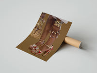 Gently curled Legs in Jeweled Platform Heels print beside its protective shipping tube
