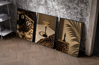 Leopard Print Still Life Set of 3 as black-framed prints leaning against a raw-plaster wall
