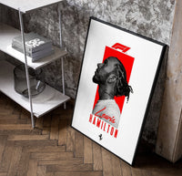 Lewis Hamilton profile portrait poster in a black frame leaning beside a shelf in a raw-plaster loft