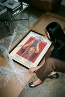 A Lionel Messi Barcelona Portrait poster showing the footballer in a blue and red jersey with raised arms.